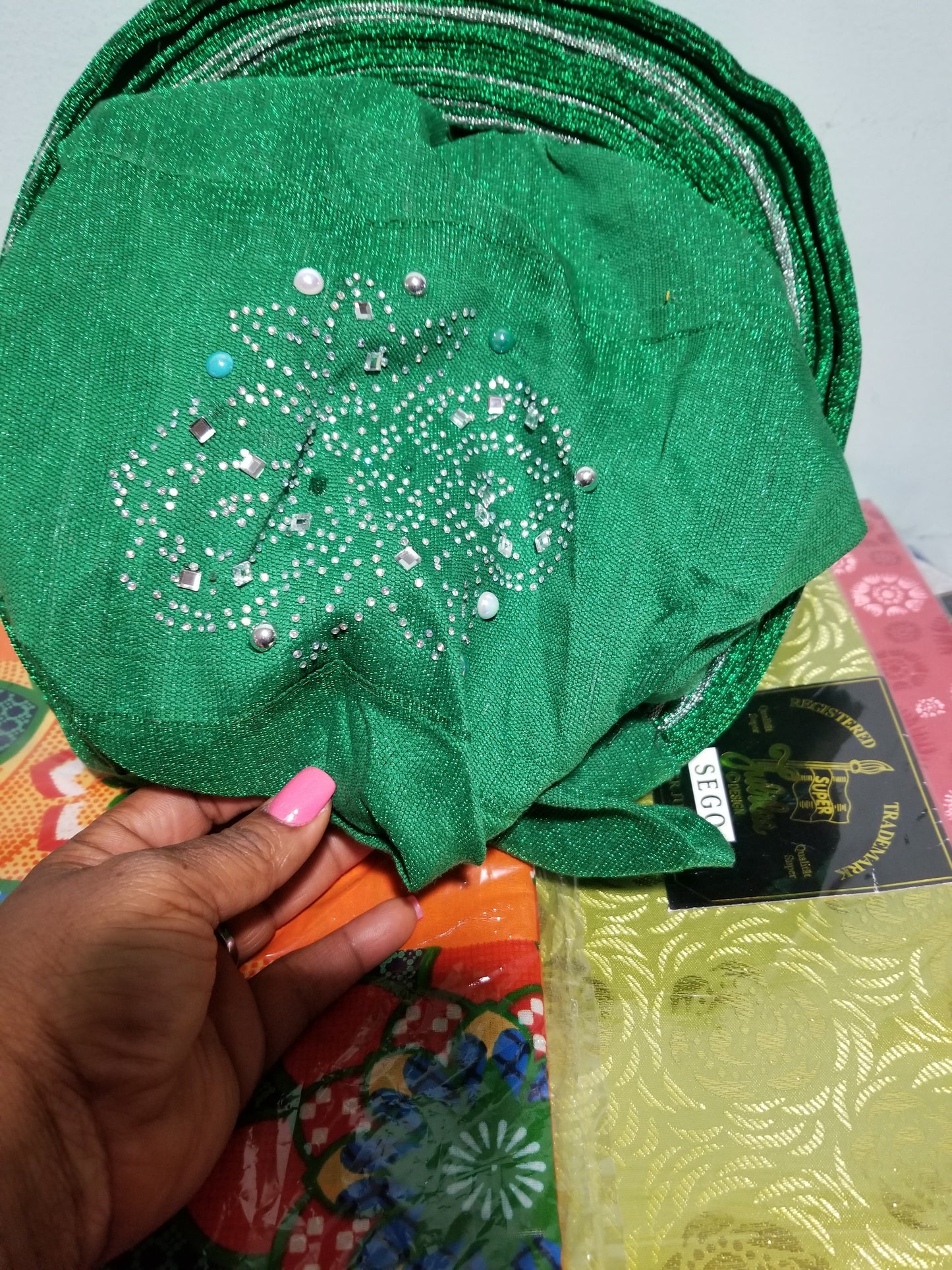 Green/silver Auto-gele made with quality Aso-oke. Beaded and stoned quality hand work. One size fit, easy to adjust for fit and knot at the back