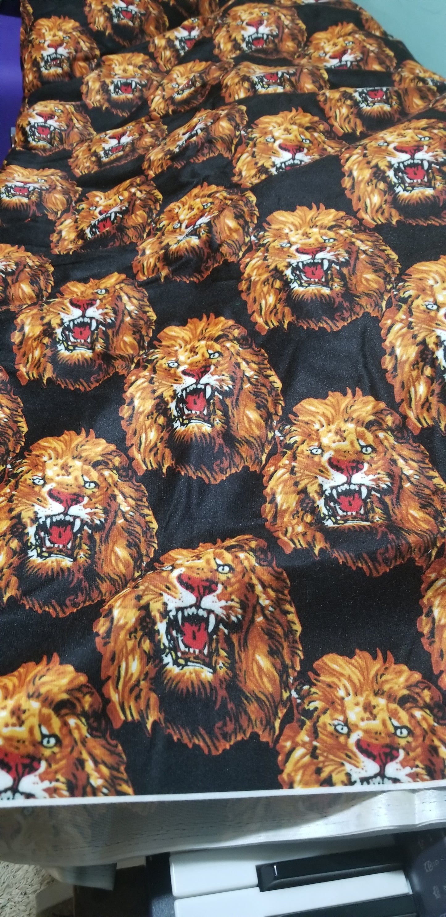 New arrival Isi-agu Igbo traditional/ceremonial fabric for men or womem. Lion head print. Sold per one yard. Price is for a yard. Can be use for wrapper, blouse or shirt for men. Black/Gold