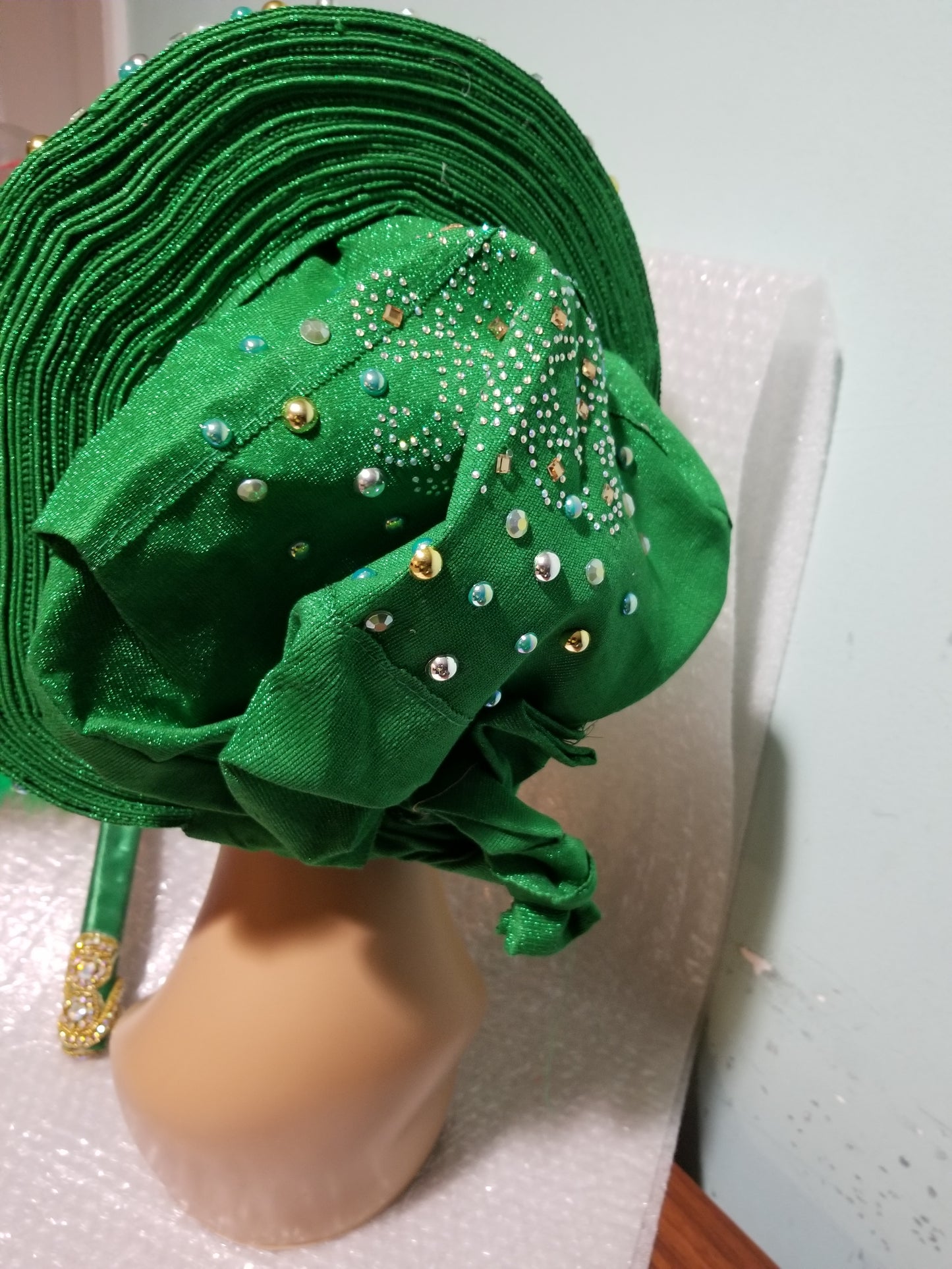 Clearance: Ready to ship Nigerian Green auto-gele. Wahala free gele all ready made for you with quality aso-oke from mother land. Embellished with beads and stones.
