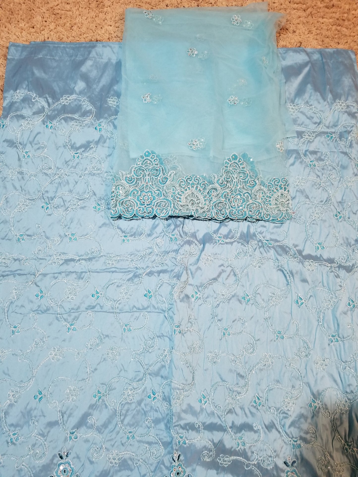 Clearance sale: sky blue Embriodered Taffeta silk George wrapper 5yds + 1.8yds. Matching net blouse fabric. Small-George Sold as a set. All over embriodery + border hand cut