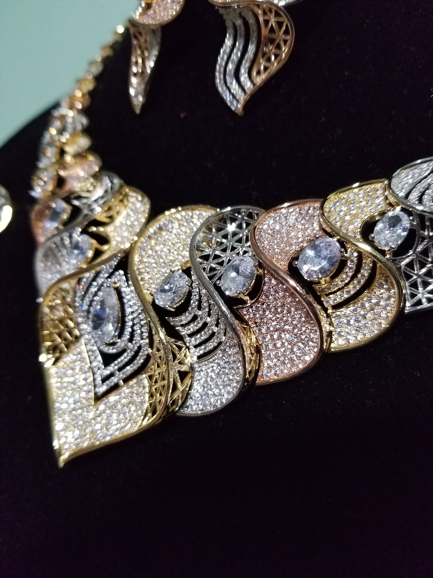 New arrival Celebrant 4pcs set of 22k Electroplated high quality CZ diamond shinning stones, 3 tone necklace set, Quality stone setting, hypoallergenic. Matching bangle/earrings/ring