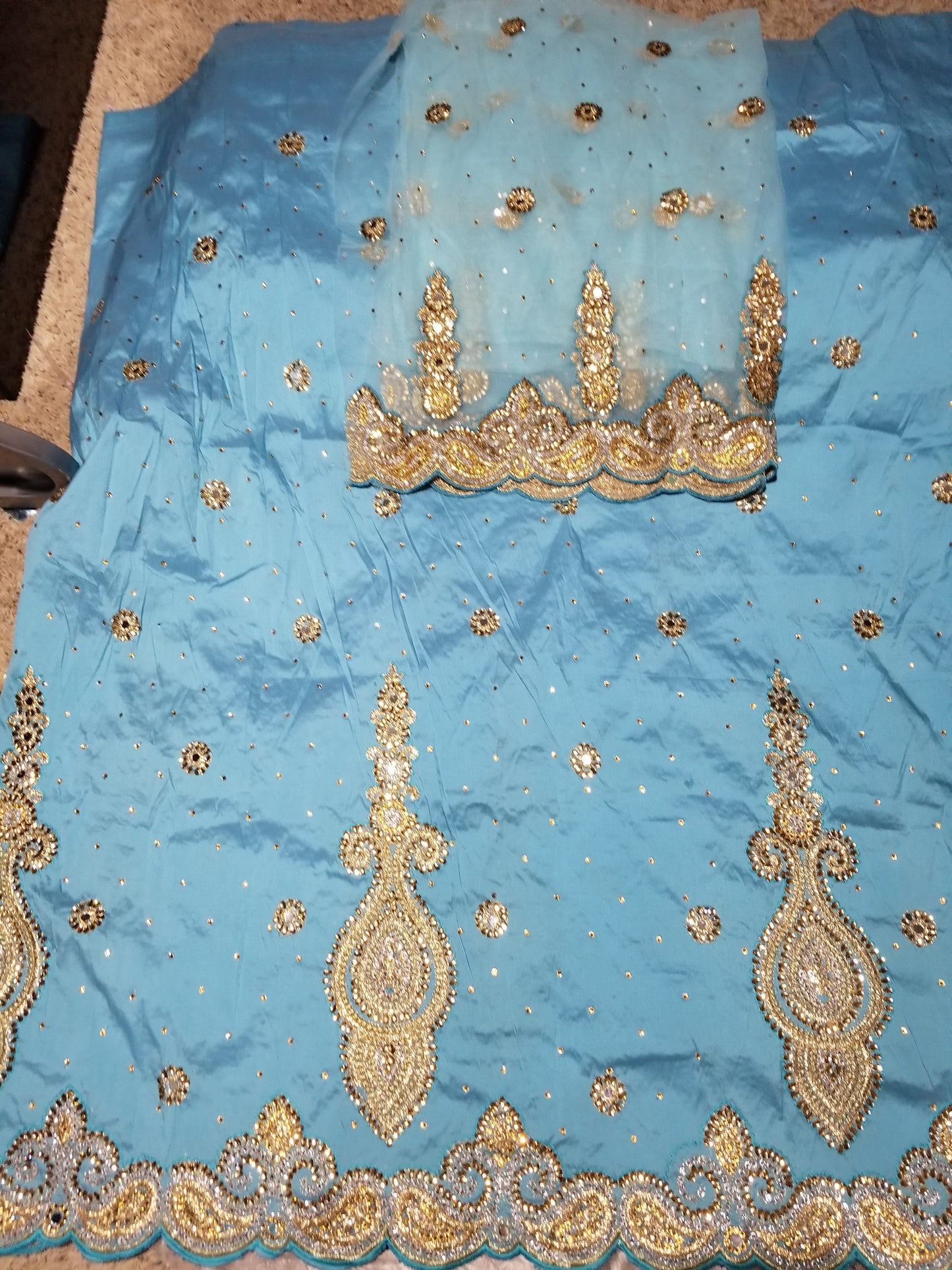 SALE,SALE- New arrival Nigerian Tranditional wedding George wrapper. Embellished with quality dazzling beads/crystal stones design in sweet sky blue. Full 5yds + 1.8yds matchingblouse . Indian-George.