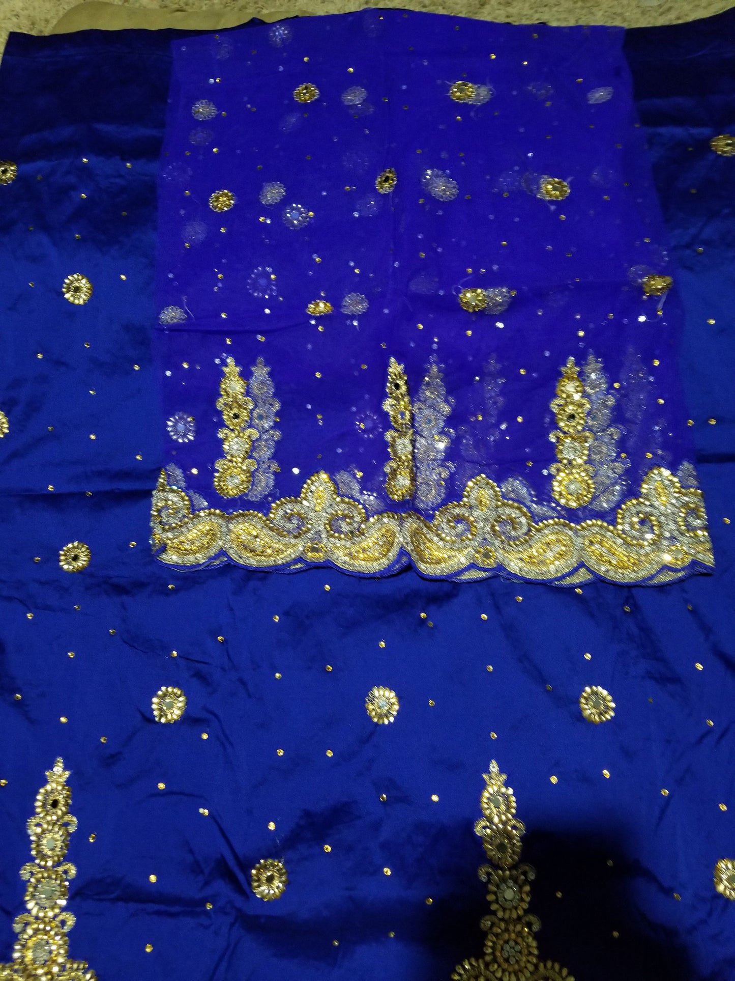 SALE,SALE- New arrival Nigerian Traditional wedding George wrapper. Embellished with quality dazzling beads/crystal stones design in royal blue. Full 5yds + 1.8yds matching blouse. Indian-George.