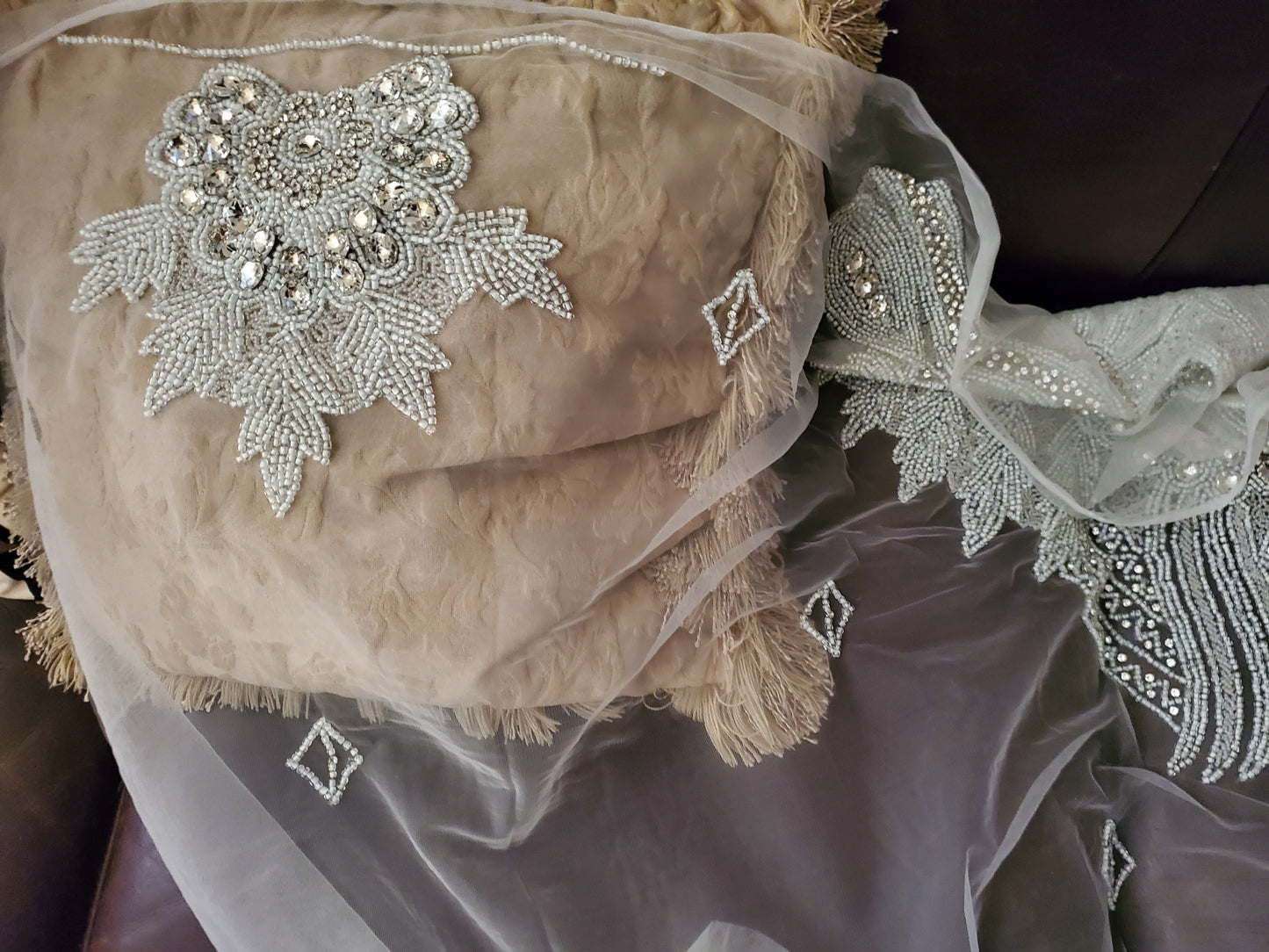 Pure white Heavily-beaded/crystal stones net George for making blouses. Popularly use by Igbo/Delta/edo women for big Occasions. Comes in 1.8yds lenght already design for your beautiful celebrant blouse