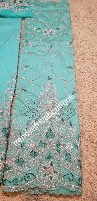 New arrival VIP/Celebrant Silk George wrapper in Mint green. All hand stoned . 5yds and 1.8yds matching net blouse for that special Occasion. Nigerian Traditional Igbo wedding wrapper