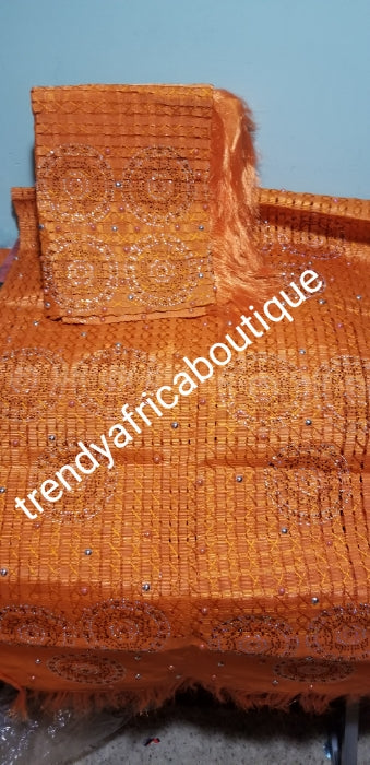 Nigerian Celebrant beaddazzled Aso-oke set in beautiful Orange. Sold as 2pcs set original quality design. aso-oke for gele/Ipele (shoulder shawl). Extra wide Gele /Ipele. Sold as a set.