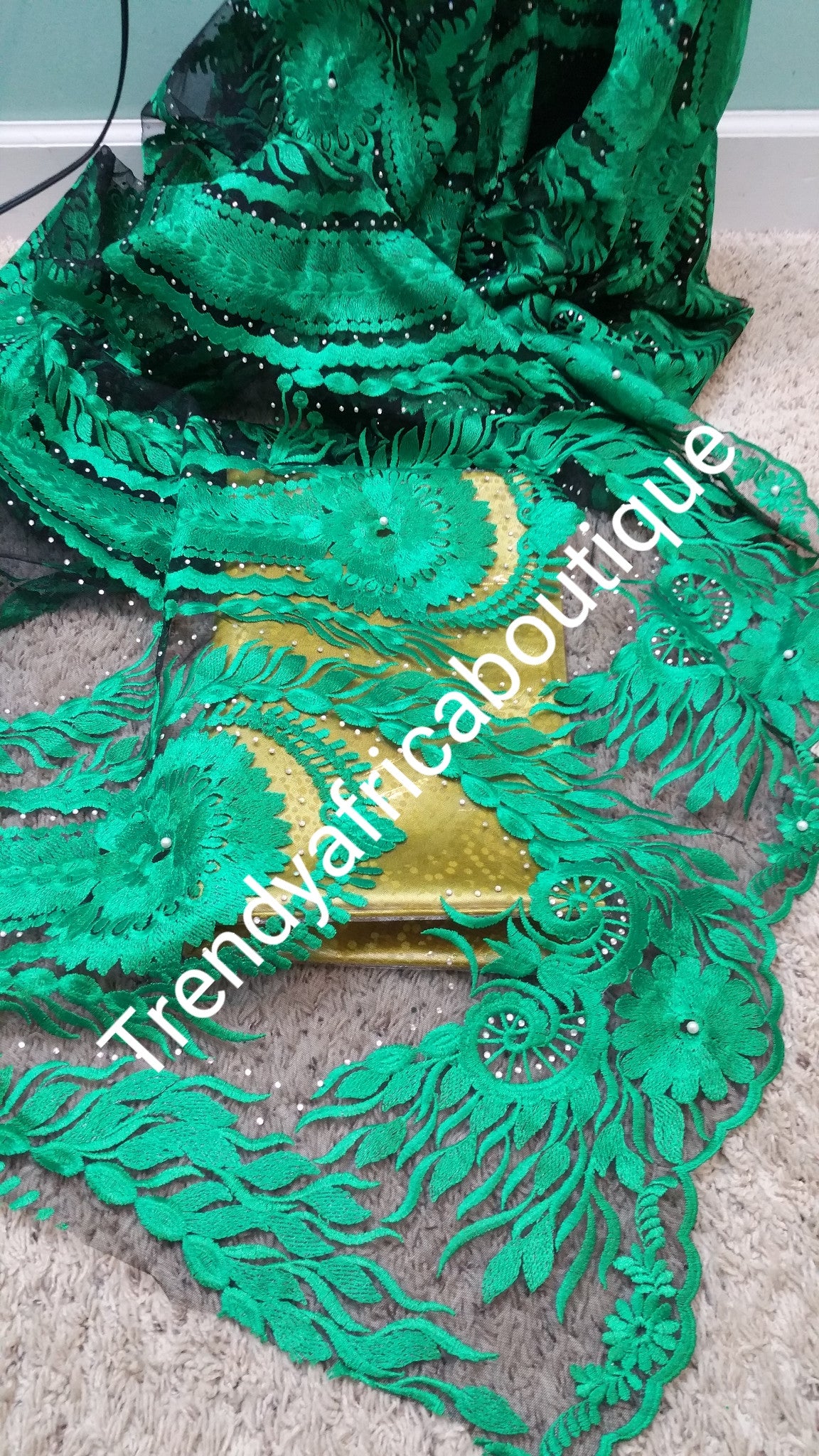 African net french lace fabric with all over stones. GREEN color. Sold 5yds. Model shown wearing purple
