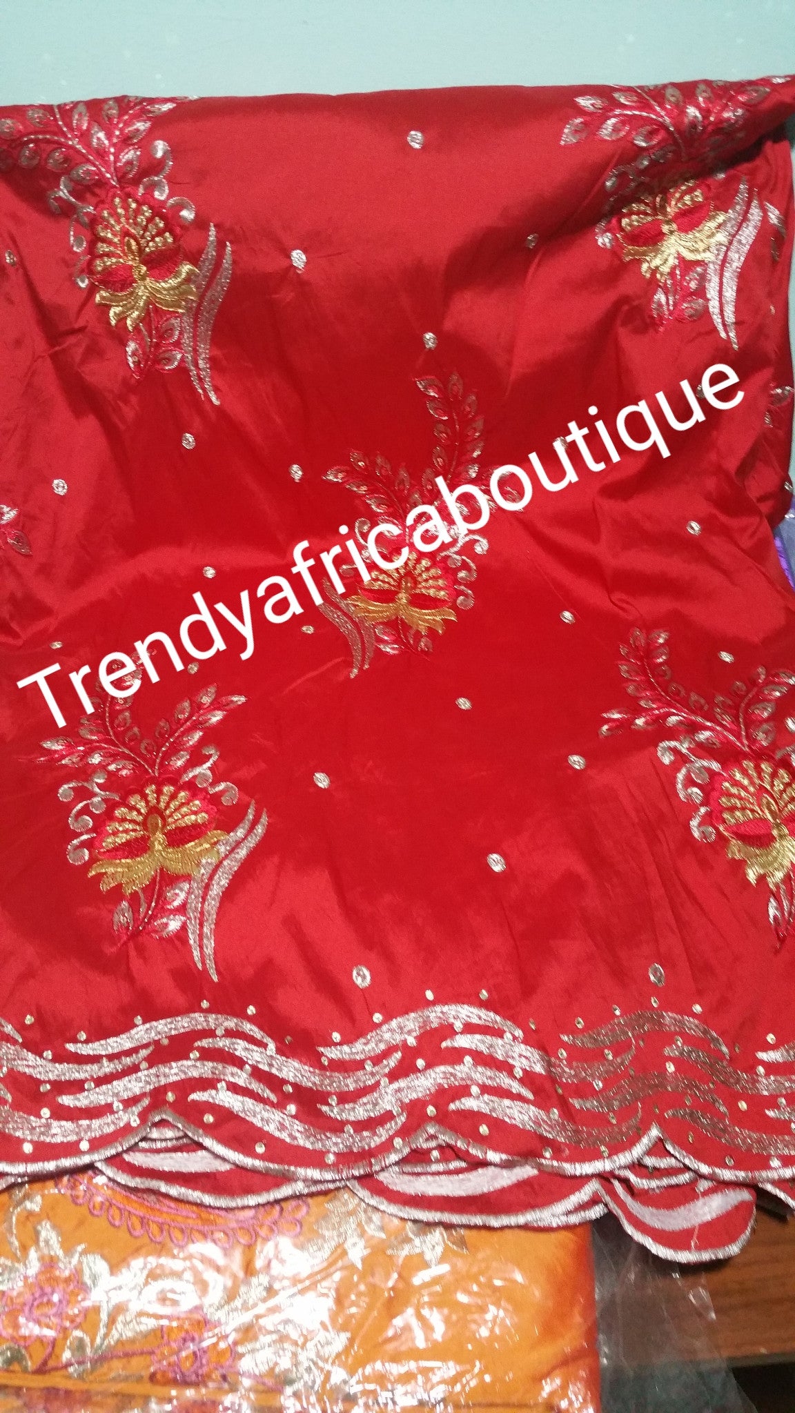 Embroidery Indian Silk George wrapper. Sold 5 yards lenght.embroidery and stones design for African party dress. Available in Green, red and Orangel. Small-George