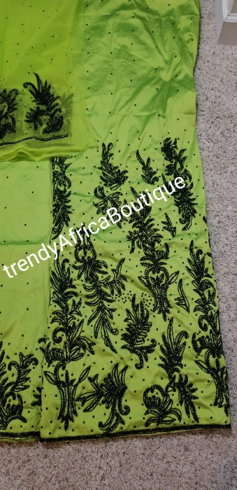 New arrival super VIP Quality Silk George wrapper. Lemon Green/black hand stoned beads. 2.5yds full bead work and 2.5yds border bead work with matchimg net blouse. Sold as a set