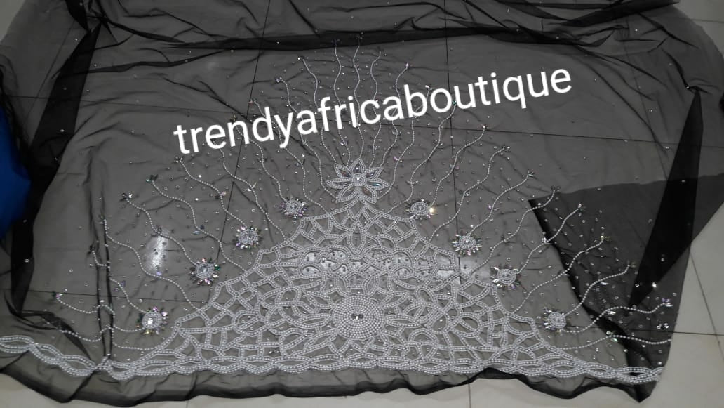 Currently sold out. Allow 3-4 weeks for production. VIP Celebrants George Wrapper in a unique color of Black/white. All over hand stoned Supper quality Silk George for that special occasion. Sold as 2.5yds + 2.5yds wrappers + 1.8yds net blouse