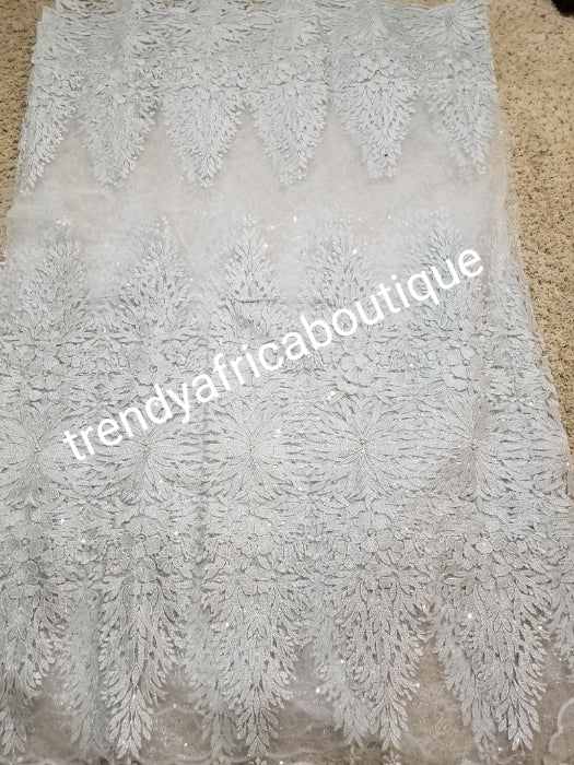 Sale: New arrival Classic white/silver sparkles African French Lace fabric. Beautiful quality, Unique design for making wedding dresses, Nigerian party dresses. Sold per 5yds. Model show wearing magenta color