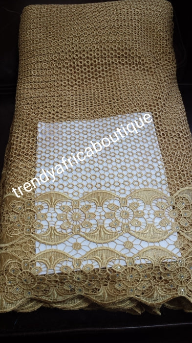 Clearance item: Gold African guipure lace, cord-lace fabric. Sold per 5yds . Excellent quality, hand cut border, embellished with crystal stones