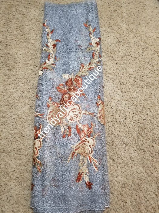 New Arrival Big Quality African French lace Fabric. Soft texture, excellent embriodery work. Rear color combination. Gray color fabric accent with Burnt orange/champagne embriodery. Sold per 5yards.Nigerian Celebrant fabric