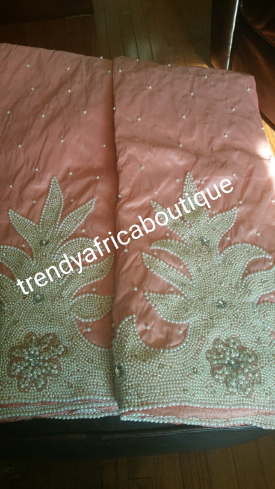 On sale: Latest Design of taffeta Silk George wrapper fabric in Peach color. Classic design Nigeria/Igbo Celebrant George. Hand beaded and stoned to perfection. 5yds + 1.8yrds matching Blouse