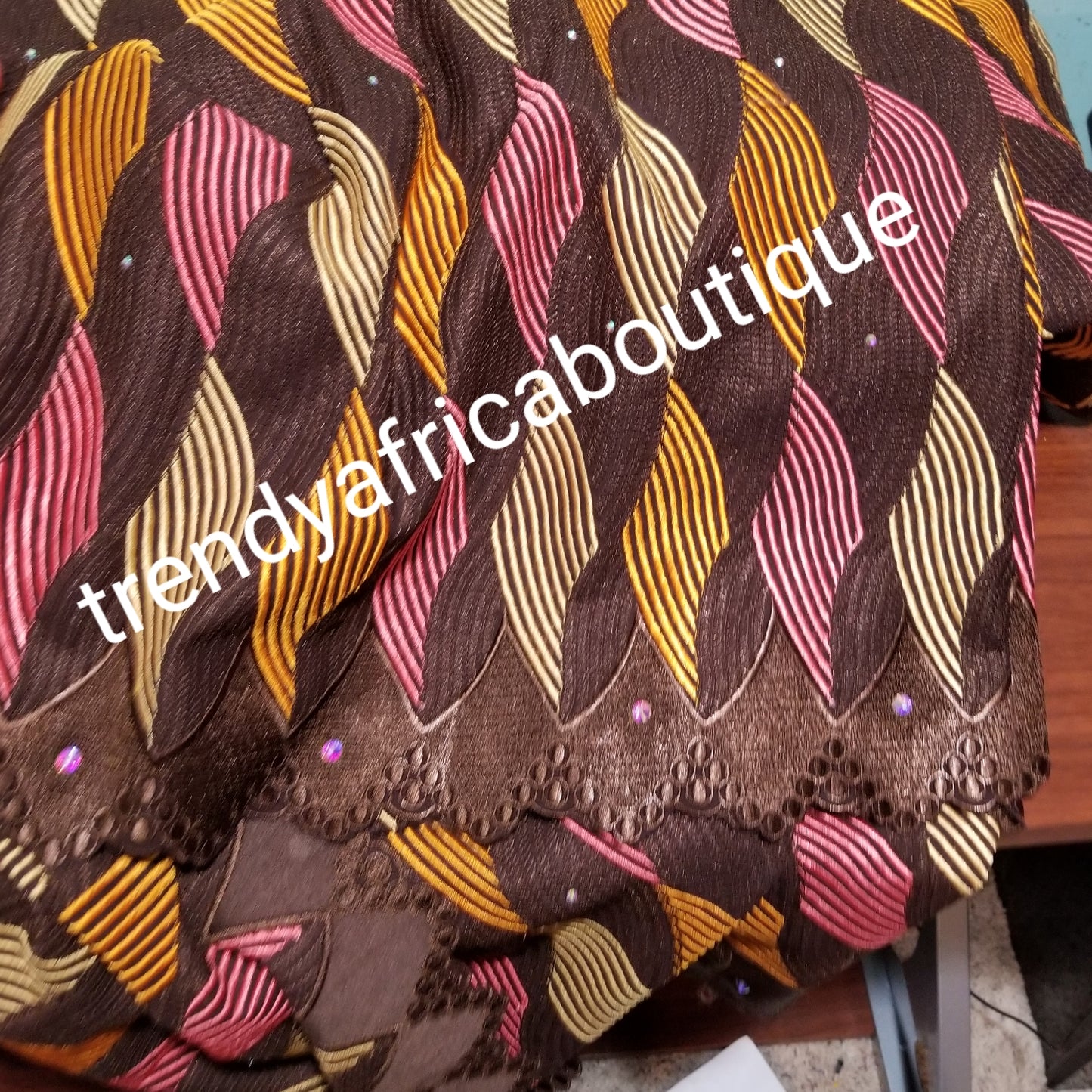 Quality embroidery Swiss lace fabric. Coffee brown lace background. Soft texture, quality embroidery on chocolate background with multi color embriodery. Sold per 5yds and price is for 5yds. Nigerian party laces at food prices