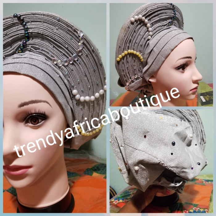 Gray Auto-gele made with quality Aso-oke. Beaded and stoned quality hand work. One size fit, easy to adjust for fit and knot at the back