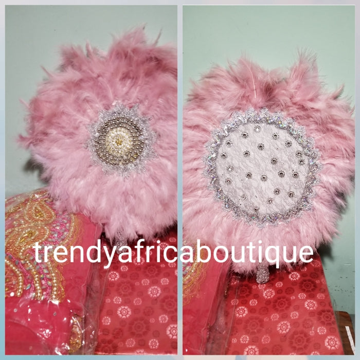 Latest feather hand fan in beautiful baby pink. Bridal Accessories hand fan for celebrant. Fully handmade with silver handle. Nigerian Bride fluffy feathers hand fan