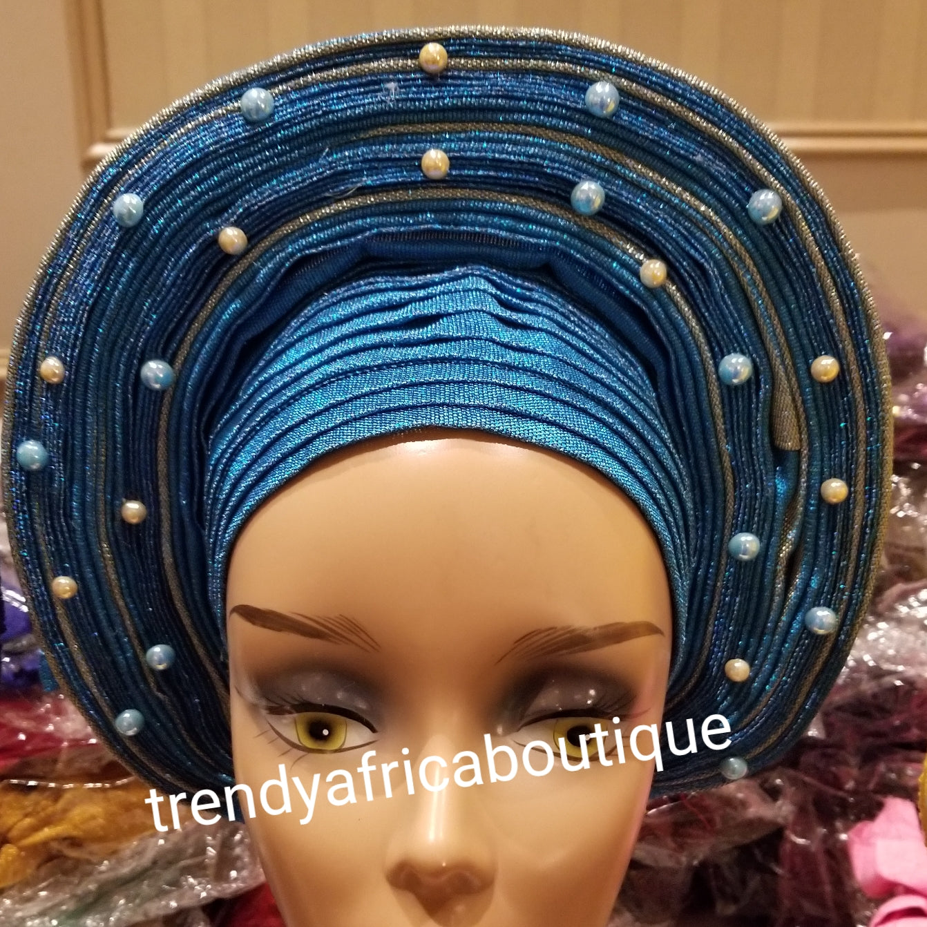 Turquoise blue/silver auto-gele. One size fit all. Wahala free gele, party ready in seconds. New arrival beaded and aso-oke gele already made