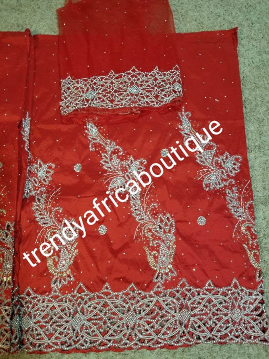 New arrival:Red VIP Celebrant Nigerian women George wrapper. Niger/Igbo/delta traditional wedding George hand stoned with dazzling crystal stones to perfection. for special occasion. 2.5yds + 2.5yds + 1.8yds net blouse. Beautiful handcut work