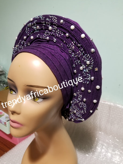 Sweet Purple Auto-gele made with quality Aso-oke. Silver stoned work to perfection. One size fit, easy to adjust for fit and knot at the back to secure your gele. This is true original auto gele