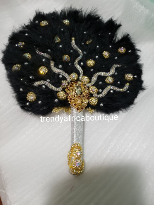 Black/Gold color, Nigerian hand made Feather hand fan. Custom made, front design beaded and stoned. Small size hand fan Nigerian Bridal-accessories design with beads and flower petal.