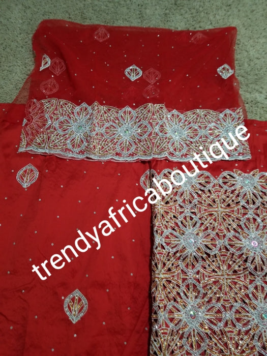 Latest VIP hand cut embriodery Silk George wrapper and matching net blouse. Pepper red George, All Crystal stones to perfection. Quality Guaranteed. 2 wrapper of 2.5yds each and 1.8yds blouse. Nigerian madam George/Igbo Delta women