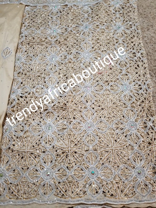 Beige design VIP hand cut embriodery Silk George wrapper and matching net blouse. Beige George, All Crystal stones to perfection. Quality Guaranteed. 2 wrapper of 2.5yds each and 1.8yds blouse. Nigerian madam George/Igbo Delta women wrapper