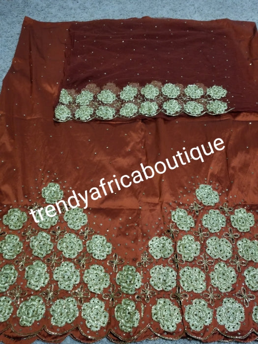 New arrival Burnt Orange/gold quality Silk George wrapper. Gold embriodery + all over crystal stone work. Classic design Niger/delta/igbo George design for Nigerian wedding and more. 5yds + 1.8yrds matching Blouse. Indian-george