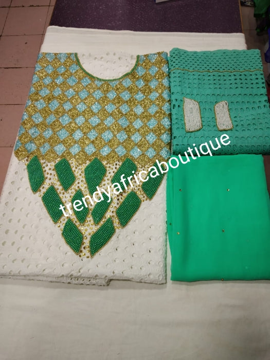 African lace fabric in 3yrds. Embellished with Beads and stoned neckline + 2yds wrapper + 1.5yds headwrap 6.5yds total as a set. Quality stone work for kaftan dress. White/mint green color combination