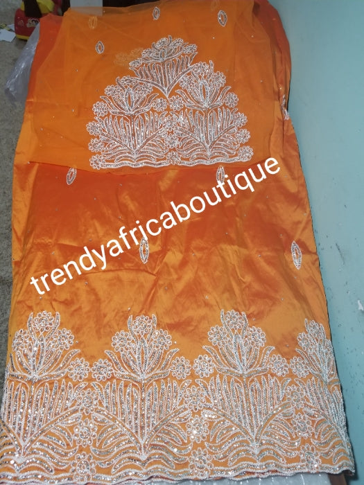 Original quality taffeta George wrapper. beautiful orange embriodery/crystal stones George Wrapper. dazzling crystal stones to perfection. Small-George. Model wearing similar George. Aso-ebi Georges