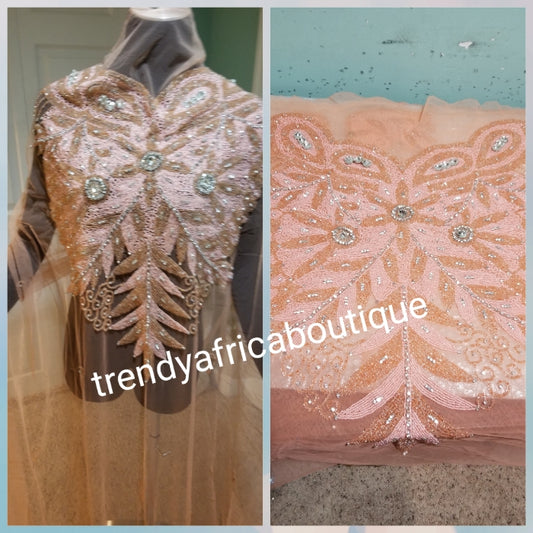 Sweet peach  Heavily-beaded net for making modern blouses. Popularly use by Igbo/Delta/edo women for big Occasions. Comes in 1.8yds lenght already design for your beautiful blouse. 1.8yds × 55" width.