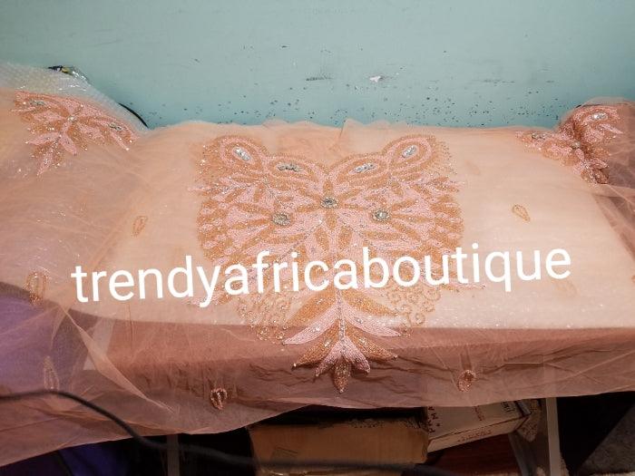 Sweet peach Heavily-beaded net for making modern blouses. Popularly use by Igbo/Delta/edo women for big Occasions. Comes in 1.8yds lenght already design for your beautiful blouse. 1.8yds × 55" width.
