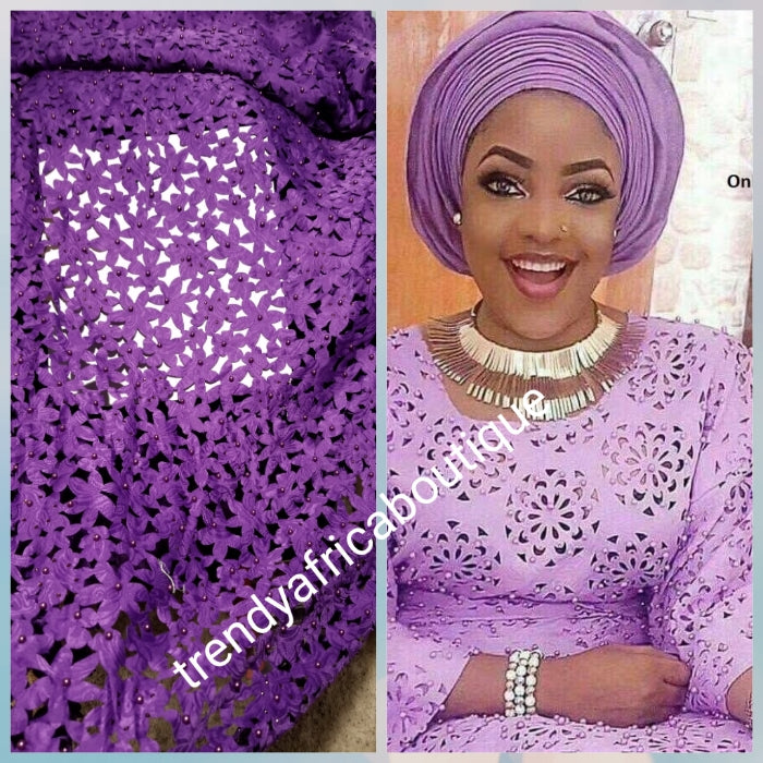 New arrival top quality purple Laser cut African French Lace fabric. Beaded amd stones to perfection. Full lacer cut. Sold per 5yds. Price is for 5yds
