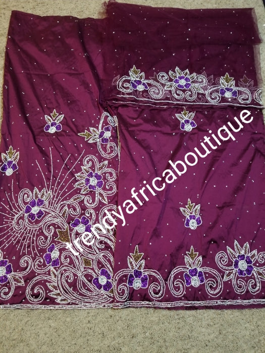 Special offer Nigerian Traditional wedding hand stoned silk George Wrapper and matching net blouse. Purple silk George embellished with crystal stones. Beaded and stoned on the side border as well