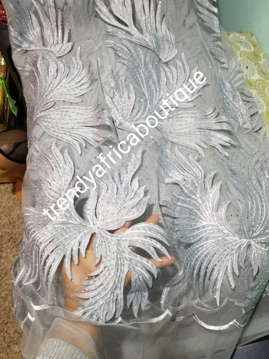 New arrival silver/Gray classic French lace design. Swiss quality embellished with crystal stoned. Sold per 5yds. Nigerian french lace fabric. Rich quality for wedding dress. For making Nigerian party dresses.