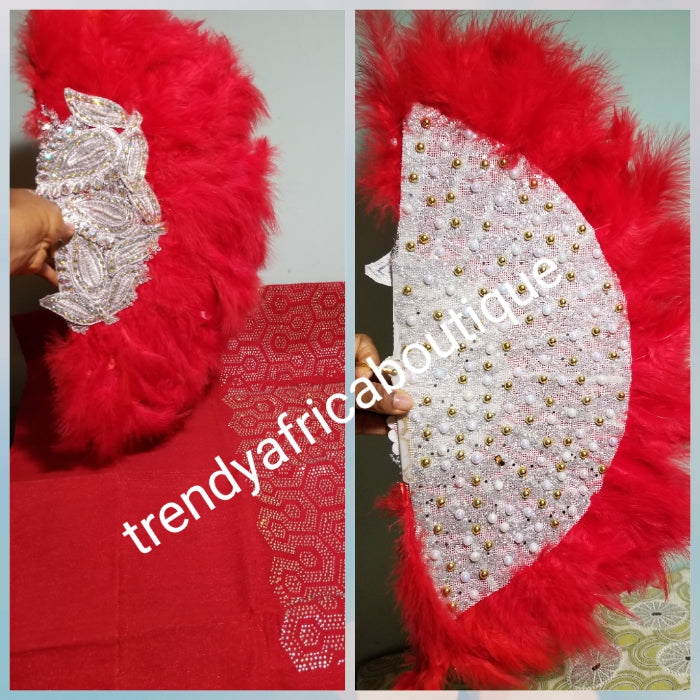 Reduced price: Red million stoned Aso-oke set. 4pc wide Gele with 72" long Ipele (shoulder shawl). Sold as a set. Price is for set. Nigerian Celebrant Aso-oke set + fila piece from Nigeria. All over Swarovski stone work on gele/ipele. Colmes with fila