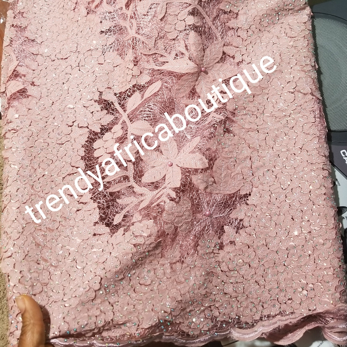 New arrival Onion pink French lace design. Swiss quality embellished with crystal stoned. Sold per 5yds. Nigerian french lace fabric. Rich quality for wedding dresses. For making Nigerian party dresses.