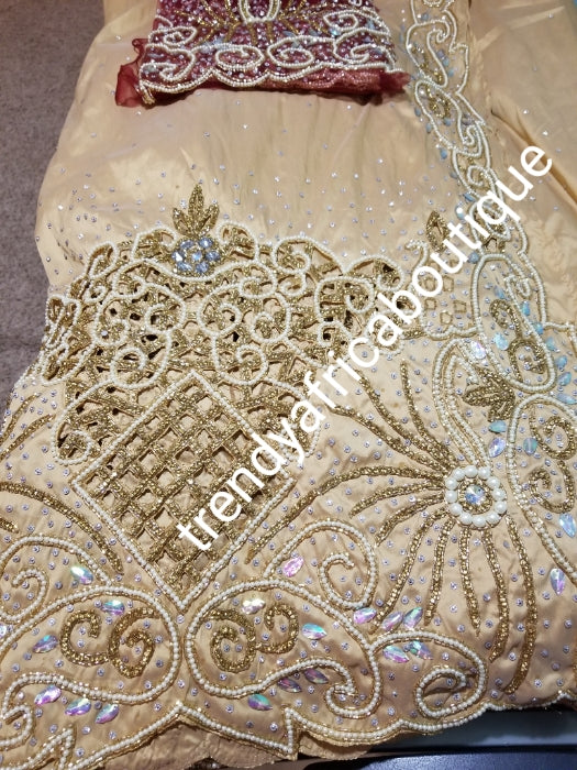 Special Offer: Ready to ship. Champagne Gold/Wine Blouse Celebrants VIP hand Stoned with dazzling Crystal stones George wrapper. 2.5yds + 2.5yds + 1.8 yds matching net blouse. Exclusive handcut design for Igbo/delta women or men outfit