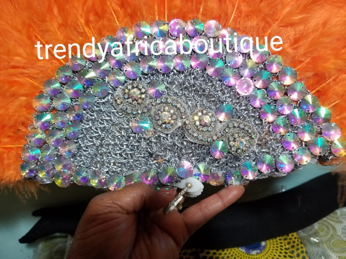New arrival Orange Feather hand fan. Medium size moon shape hand fan Nigerian Bridal-accessories front and back design with gold beads and flower petal. Limited quantity. 19" long + 14" wide. Small handle to hold your fan. Very classy