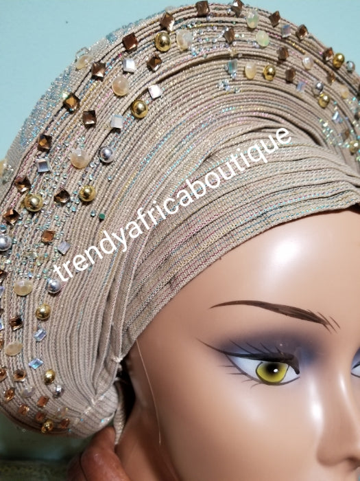 Quality champagne gold Auto-gele made with quality Aso-oke. Beaded and stoned work front and back to perfection. One size fit, easy to adjust for fit and knot at the back to secure your gele. This is true original auto gele