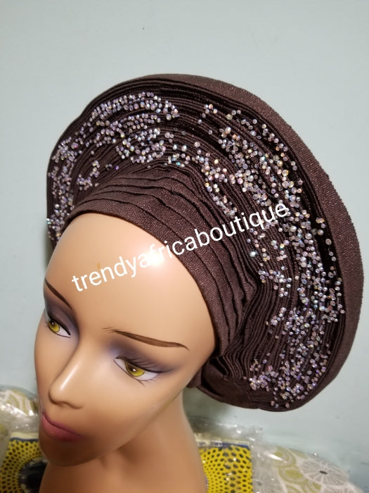 Quality chocolate brown Auto-gele made with quality Aso-oke. Beaded and stoned work front and back to perfection. One size fit, easy to adjust for fit and knot at the back to secure your gele. This is true original auto gele