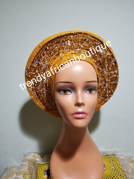 Clearance: Beaded and stoned Gold Auto-gele made with quality Aso-oke. Beaded and stoned work front and back to perfection. One size fit, easy to adjust and knot at the back to secure your gele. This is true original auto gele
