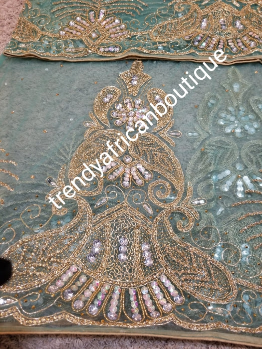 Ready to Ship: Gorgeous Igbo Traditional Bridal outfit- in mint green net George wrapper and matching net for blouse. embellished with dazzling Crystal stones all over. 2 wrapper + 1.8yds net for blouse. Classic green net Ideal for making Celebrant outfit