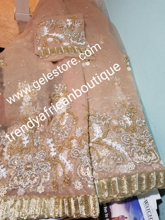 Ready to ship. Classic champagne gold net George. perfect stone work for traditional Bridal outfit. Quality beaded and dazzling crystal stoned on a net George wrapper. 2.5yds + 2.5yds + 2yds.fabric. Sold as a set, price is for a set.