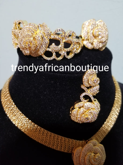 Exclusive Rich Celebrants 4pcs matching set of 22k Gold high Electroplated mounted with quality CZ diamond shinning stones setting. Hypoallergenic. Necklace, earrings, ring and bangle set. Open ring for adjustment, classic bold flower pendant