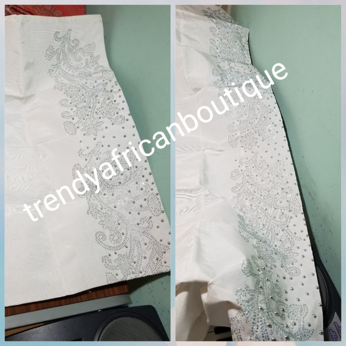 Combo sale: White crystal Net George wrapper 2.5yds Net+ 2.5yds taffeta silk+ 1.8yd net for blouse+ white aso-oke gele all embellished with dazzling silver crystal stones. Nigerian Bridal George for that special occasion. Quality