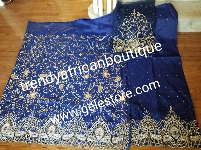 New arrival Navy Blue VIP Silk George wrapper. 2.5yds top wrapper heavily beaded and crystal stones + 2.5yds bottom wrapper stone border + 1.8yds net blouse. Use For Nigerian weddings/Ceremonies.