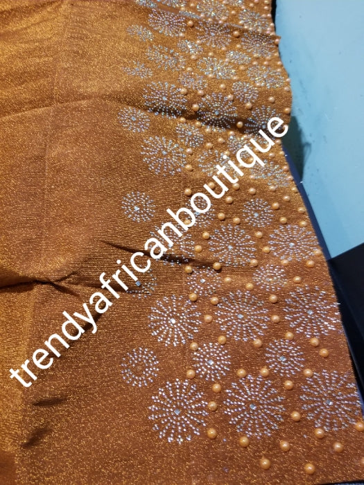 Classic Burnt Orange Bedazzled aso-oke. Nigerian woven traditional Aso-oke for making beautiful head wrap. Beaded and Swarovski stones work for perfect headwrap finish. Gele only. Extra wide gele for bigger head wrap. 72" long × 26" wide
