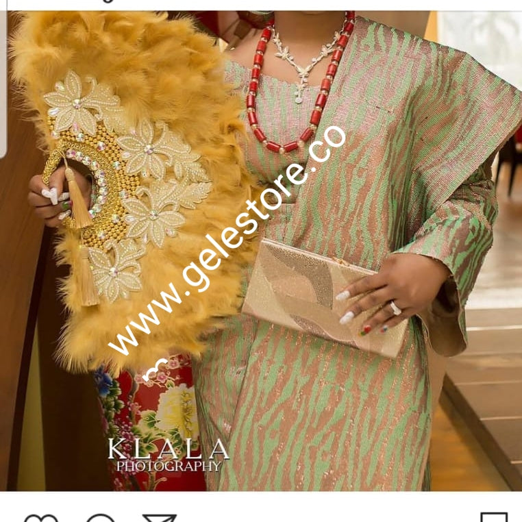 Large Black/gold color, Nigerian made fluffy Feather hand fan. Hand made same front and back design with gold handle, 2 drop tassels and gold petals and beads Bridal-accessories design with beads and flower petal. Model shown is gold color