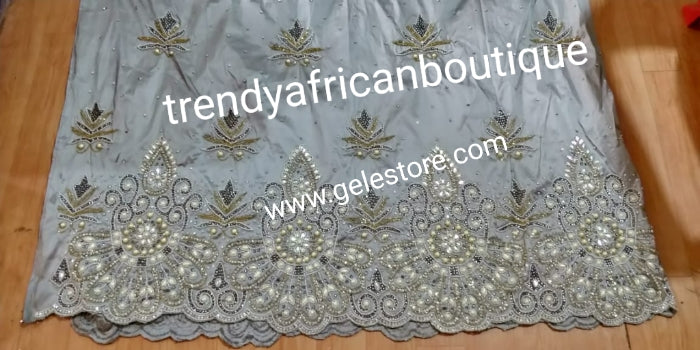 Ready to ship quality ash/Gray Taffeta Silk Beaded and Stoned Nigerian traditional wedding George wrapper. Classic Wrapper for Niger/Igbo/delta wedding outfit. Sold as 2 wrapper + matching net for blouse. Quality guarantee!!!